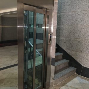 آسانسور هیدرولیک شیشه ای در چشمی پله